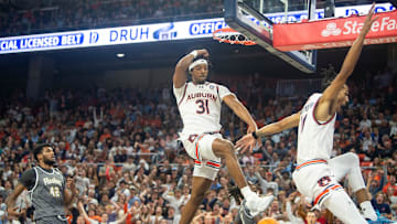 Auburn Tigers forward Chaney Johnson (31) dunks the ball on a fast break as Auburn Tigers take on Kent State Golden Flashes at Neville Arena in Auburn, Ala., on Saturday, Nov. 13, 2024. Auburn Tigers lead Kent State Golden Flashes 36-22 at halftime.