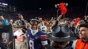 Auburn Tigers head coach Hugh Freeze and wide receiver Cam Coleman (8) hug after the game as Auburn Tigers take on Texas A&M Aggies at Jordan-Hare Stadium in Auburn, Ala., on Saturday, Sept. 7, 2024. Auburn Tigers defeated Texas A&M Aggies 43-41 in fourth overtime.