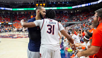 Auburn Tigers forward Johni Broome (4) hugs Auburn Tigers forward Chaney Johnson (31) as he checks out of the game as Auburn Tigers take on Georgia State Panthers at Neville Arena in Auburn, Ala., on Tuesday, Dec. 17, 2024. Auburn Tigers defeated Georgia State Panthers 100-59.