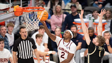 Auburn Tigers guard Denver Jones (2) goes up for a layup as Auburn Tigers take on Purdue Boilermakers at Legacy Arena in Birmingham, Ala., on Saturday, Dec. 21, 2024. Auburn Tigers defeated Purdue Boilermakers 87-69.
