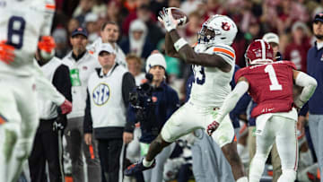 Auburn Tigers tight end Rivaldo Fairweather (13) catches a pass as Auburn Tigers take on Alabama Crimson Tide at Bryant-Denny Stadium in Tuscaloosa, Ala., on Saturday, Nov. 30, 2024. Alabama Crimson Tide defeated Auburn Tigers 28-14.