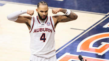 Auburn Tigers forward Johni Broome (4) celebrates an and-one play as Auburn Tigers take on Missouri Tigers at Neville Arena in Auburn, Ala., on Saturday, Jan. 4, 2025. Auburn Tigers defeated Missouri Tigers 84-68.