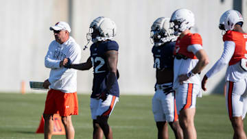 Auburn Tigers head coach Hugh Freeze shakes hands with running back Alvin Henderson (22) during football practice at Woltosz Football Performance Center in Auburn, Ala., on Thursday, April 10, 2025.