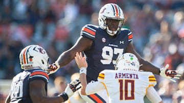 Auburn Tigers defensive lineman Quientrail Jamison-Travis (97) sacks Louisiana-Monroe Warhawks quarterback Aidan Armenta (10) as Auburn Tigers take on Louisiana-Monroe Warhawks at Jordan-Hare Stadium in Auburn, Ala., on Saturday, Nov. 16, 2024. Auburn Tigers defeated Louisiana-Monroe Warhawks 48-14.