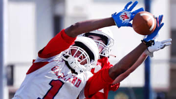 Oakland's Craig Tutt (1) reaches for a pass during a spring football practice at Oakland on Wednesday, April 30, 2025.