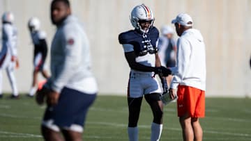 Auburn Tigers head coach Hugh Freeze shakes hands with wide receiver Malcolm Simmons (4) during football practice at Woltosz Football Performance Center in Auburn, Ala., on Thursday, April 10, 2025.