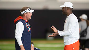 Auburn Tigers head coach Hugh Freeze talks with offensive coordinator Derrick Nix during practice at Woltosz Football Performance Center in Auburn, Ala. on Thursday, Aug. 14, 2025.