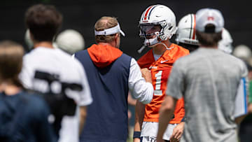 Auburn Tigers head coach Hugh Freeze talks with quarterback Jackson Arnold (11) during practice at Woltosz Football Performance Center in Auburn, Ala. on Thursday, Aug. 14, 2025.