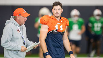 Auburn Tigers head coach Hugh Freeze talks with quarterback Jackson Arnold (11) during practice at Woltosz Football Performance Center in Auburn, Ala. on Tuesday, Aug. 26, 2025.