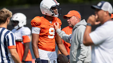 Auburn Tigers quarterback Deuce Knight (9) talks with head coach Hugh Freeze during practice at Woltosz Football Performance Center in Auburn, Ala. on Tuesday, Aug. 26, 2025.