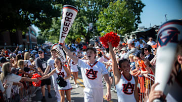 Auburn cheerleaders greet fans during Tiger Walk before Auburn Tigers take on South Alabama Jaguars at Jordan-Hare Stadium in Auburn, Ala. on Saturday, Sept. 13, 2025.