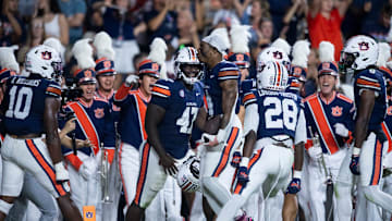 Auburn Tigers defensive back Kayin Lee (4) celebrates his interception as Auburn Tigers take on Missouri Tigers at Jordan-Hare Stadium in Auburn, Ala. on Saturday, Oct. 18, 2025. Missouri Tigers lead Auburn Tigers 10-7 at halftime.