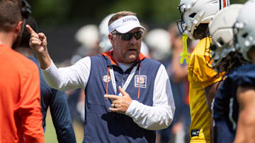 Auburn Tigers head coach Hugh Freeze talks with wide receiver Cam Coleman (8) during practice at Woltosz Football Performance Center in Auburn, Ala. on Thursday, Aug. 14, 2025.
