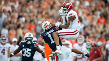 Arkansas Razorbacks quarterback Taylen Green (10) fails to hurdle over Auburn Tigers defensive back Jerrin Thompson (1) as Auburn Tigers take on Arkansas Razorbacks at Jordan-Hare Stadium in Auburn, Ala., on Saturday, Sept. 21, 2024. Arkansas Razorbacks lead Auburn Tigers 7-0 at halftime.
