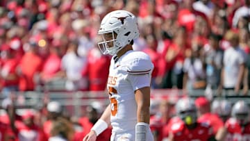 Texas Longhorns quarterback Arch Manning (16) walks back the team huddle against Ohio State Buckeyes in the first quarter of their game at Ohio Stadium in Columbus, Ohio on Aug 30, 2025.