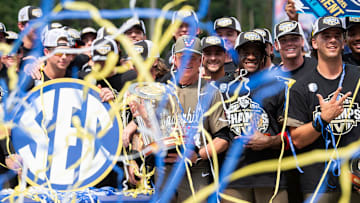 Vanderbilt Commodores head coach Tim Corbin and his team celebrate with the championship trophy as Ole Miss Rebels take on Vanderbilt Commodores during the SEC baseball tournament championship game at Hoover Met in Birmingham, Ala., on Sunday, May 25, 2025. Vanderbilt Commodores defeated Ole Miss Rebels 3-2.