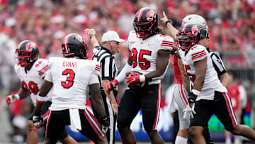 Sep 16, 2023; Columbus, Ohio, USA; Western Kentucky Hilltoppers defensive end Deante McCray (95) celebrates after recovering Ohio State Buckeyes quarterback Kyle McCord (6) fumble during the first quarter of their game at Ohio Stadium.
