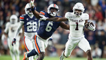 Texas A&M Aggies wide receiver Jabre Barber (1) is tackled by Auburn Tigers linebacker Austin Keys (6) as Auburn Tigers take on Texas A&M Aggies at Jordan-Hare Stadium in Auburn, Ala., on Saturday, Sept. 7, 2024. Auburn Tigers defeated Texas A&M Aggies 43-41 in fourth overtime.
