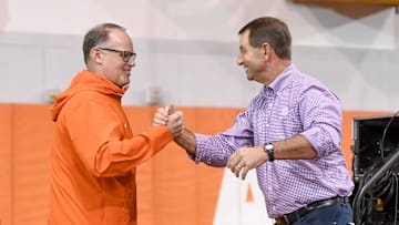 Clemson defensive coordinator Tom Allen greets head coach Dabo Swinney on the way to speaking during the Clemson Club football National Signing Day wrap up presented by Clemson Seneca Chick-Fil-A at the Poe Indoor Practice Facility at Clemson University in Clemson, S.C. Feb 5, 2025.