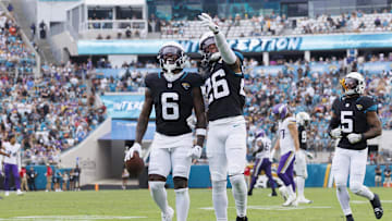 Nov 10, 2024; Jacksonville, Florida, USA; Jacksonville Jaguars safety Darnell Savage (6) celebrates an interception with safety Antonio Johnson (26) against the Minnesota Vikings during the third quarter at EverBank Stadium. Mandatory Credit: Morgan Tencza-Imagn Images