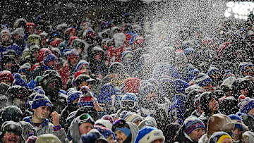 Bills fans throw snow in the air in celebration after James Cook ran 65-yards for a touchdown during first half action of their home game against the San Francisco 49ers in Orchard Park on Dec. 1, 2024.
