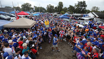 Buffalo Bills tailgate watch Ken Johnson, also known as, Pinto Ron, get sprayed with ketchup and mustard in the Hammer Lot in Orchard Park on Sept. 23, 2024.