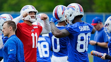 Buffalo Bills Mitchell Trubisky and Tyrell Shavers go through an elaborate handshake that also involves showing off muscles when they meet up in a smaller group where a different drill was being run at their practice facility on May 27, 2025.