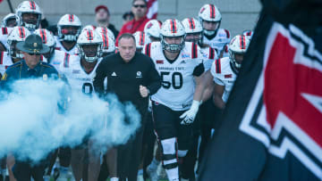Arkansas State Red Wolves head coach Butch Jones leads his team out on the field as Arkansas State Red Wolves take on the Northern Illinois Huskies during the Camellia Bowl at Cramton Bowl in Montgomery, Ala., on Saturday, Dec. 23, 2023. Northern Illinois Huskies leads Arkansas State Red Wolves 21-13.