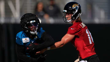 Jacksonville Jaguars quarterback Trevor Lawrence (16) hands off to running back Travis Etienne Jr. (1) during the first day of an NFL football training camp practice Wednesday, July 24, 2024 at EverBank Stadium’s Miller Electric Center in Jacksonville, Fla.
