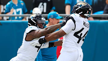 Jacksonville Jaguars defensive end Josh Hines-Allen (41), left, drills on defensive end Travon Walker (44) before an NFL football matchup Sunday, Sept. 15, 2024 at EverBank Stadium in Jacksonville, Fla. [Corey Perrine/Florida Times-Union]