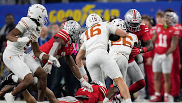 Texas Longhorns quarterback Arch Manning (16) runs the ball for a first down on fourth down in the second quarter of the Cotton Bowl Classic during the College Football Playoff semifinal game at AT&T Stadium in Arlington, Texas on January, 10, 2025.