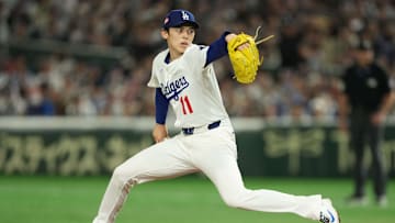 Mar 19, 2025; Bunkyo, Tokyo, JPN; Los Angeles Dodgers starting pitcher Roki Sasaki (11) delievers a pitch in the first inning against the Chicago Cubs during the Tokyo Series at Tokyo Dome. Mandatory Credit: Darren Yamashita-Imagn Images
