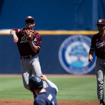 Texas A&M Aggies' Ben Royo (10) throws to first base to complete a double play as Auburn Tigers take on Texas A&M Aggies during the SEC baseball tournament at Hoover Met in Birmingham, Ala., on Thursday, May 22, 2025.