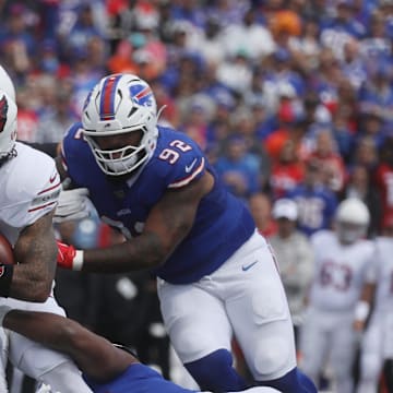 Arizona's James Conner carries the ball before getting taken down by Bills defensive end Greg Rousseau during first half action at Highmark Stadium in Orchard Park on Sept. 8, 2024.