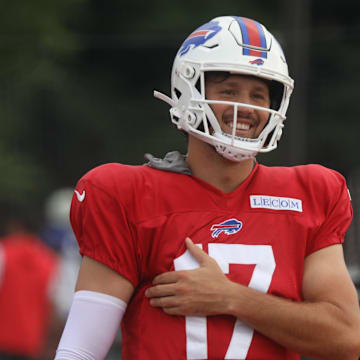 Bills' Josh Allen laughs as he jokes with teammates.
