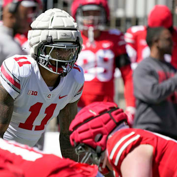 Ohio State Buckeye Gary C.J. Hicks (11) lines up on the defensive line against the Scarlet team during the spring game at Ohio Stadium on April 12, 2025.