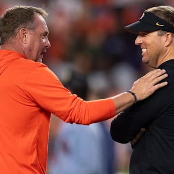 Auburn Tigers head coach Hugh Freeze and Missouri Tigers head coach Eli Drinkwitz talk during warm ups before Auburn Tigers take on Missouri Tigers at Jordan-Hare Stadium in Auburn, Ala.