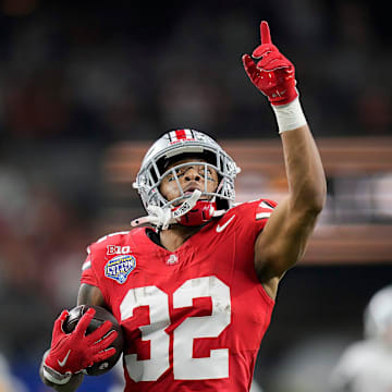Ohio State Buckeyes running back TreVeyon Henderson scores a touchdown