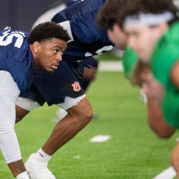Auburn Tigers defensive end Keldric Faulk runs drills during practice at Woltosz Football Performance Center