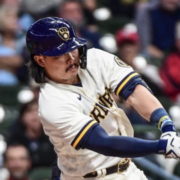 Milwaukee Brewers designated hitter Keston Hiura (18) hits an RBI double in the sixth inning against the St. Louis Cardinals at American Family Field in 2022.
