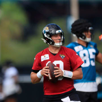 Jacksonville Jaguars quarterback Trevor Lawrence (16) and quarterback Mac Jones (10) look to pass during the third day of an NFL football training camp practice Friday, July 26, 2024 at EverBank Stadium’s Miller Electric Center in Jacksonville, Fla.