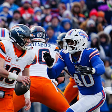 Buffalo Bills linebacker Von Miller rushes towards Denver Broncos quarterback Bo Nix.