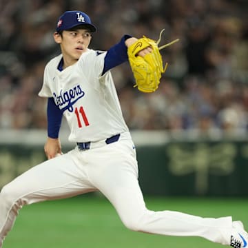 Mar 19, 2025; Bunkyo, Tokyo, JPN; Los Angeles Dodgers starting pitcher Roki Sasaki (11) delievers a pitch in the first inning against the Chicago Cubs during the Tokyo Series at Tokyo Dome. Mandatory Credit: Darren Yamashita-Imagn Images