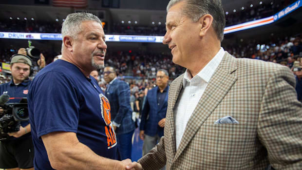 Auburn coach Bruce Pearl and former Kentucky coach John Calipari greet after last season's game 