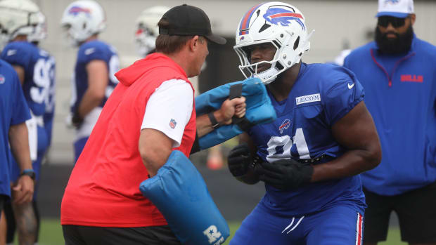 Bills Assistant Defensive Line Coach Matt Edwards and Ed Oliver work on a drill at Bills training camp.