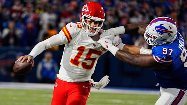 Kansas City quarterback Patrick Mahomes gets forced into throwing an incompletion by Bills Jordan Phillips