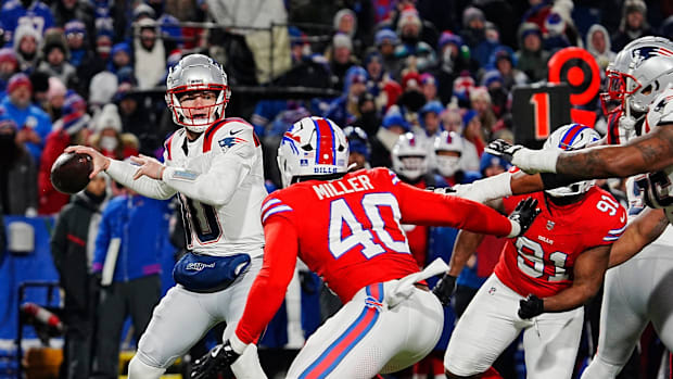 New England Patriots quarterback Drake Maye gets the pass off before Buffalo Bills linebacker Von Miller reaches him