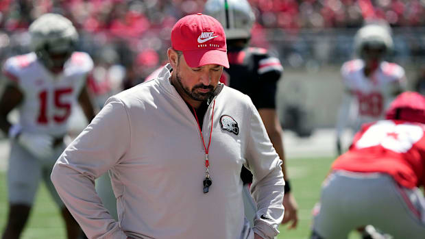 Ohio State Buckeye head coach Ryan Day looks away from the field