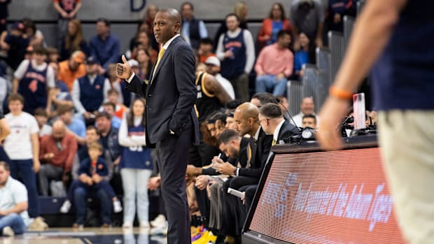 Missouri Tigers head coach Dennis Gates talks with his players from the sideline as Auburn Tigers take on Missouri Tigers.