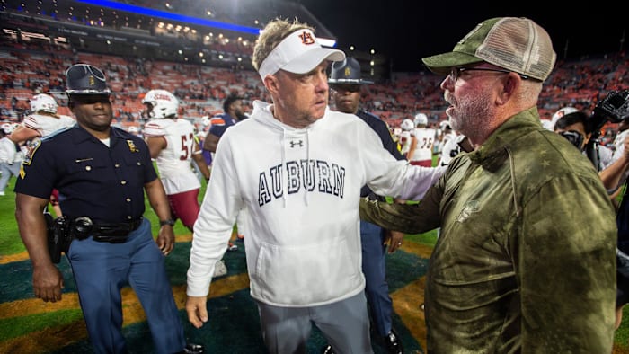 Auburn Tigers head coach Hugh Freeze and New Mexico State head coach Jerry Kill talk after Auburn